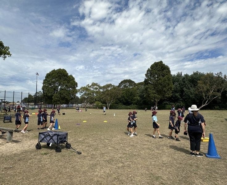 Children on a field playing sports
