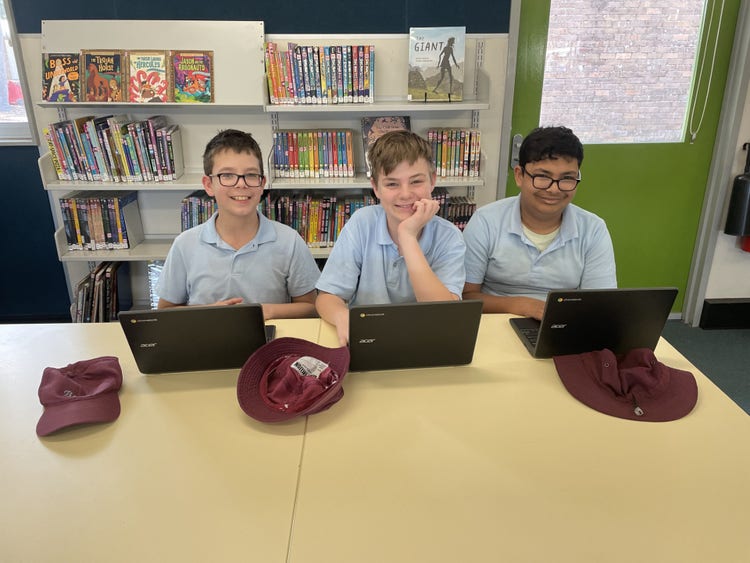 BLSPS Library with three boys using computers